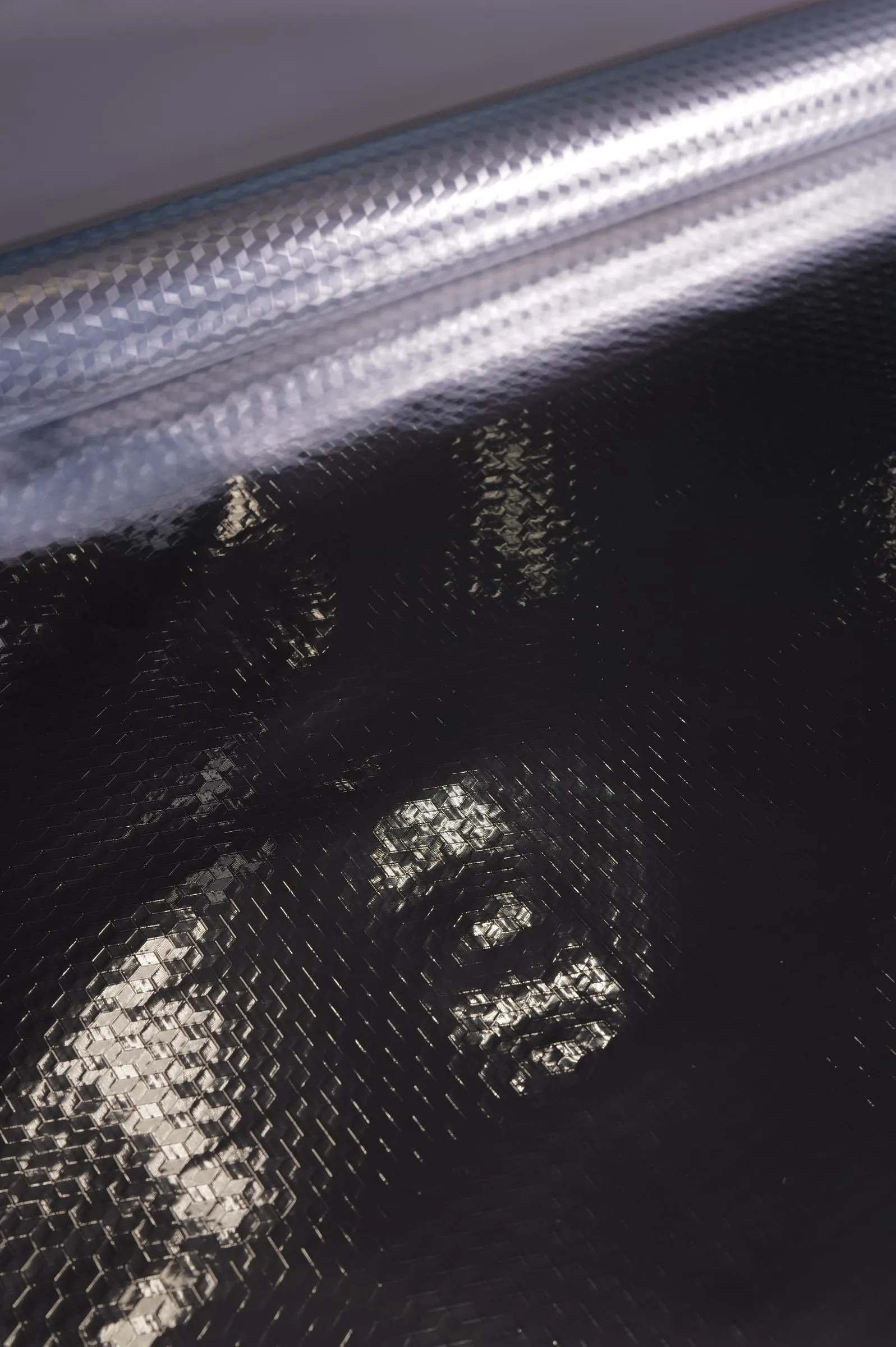 Diamond Reflective Laminate, Gloss Dark / Silver Emboss Back – texture close-up