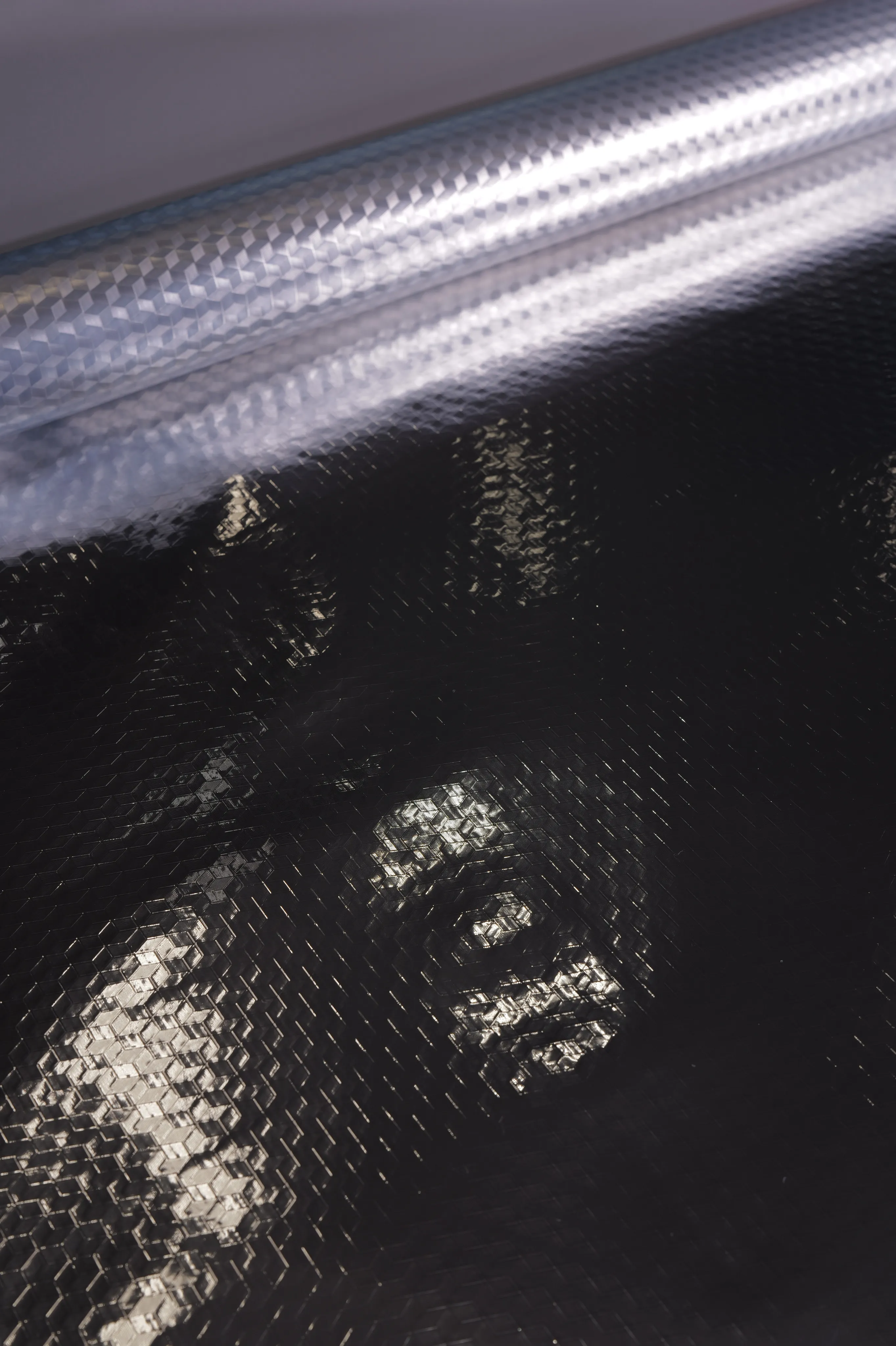 Diamond Reflective Laminate, Gloss Dark / Silver Emboss Back – texture close-up