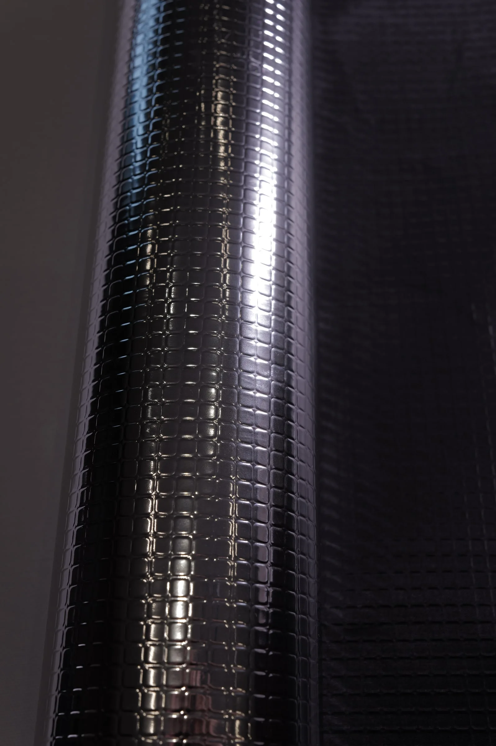 Brick Emboss Reflective Laminate, Gloss Black – texture close-up