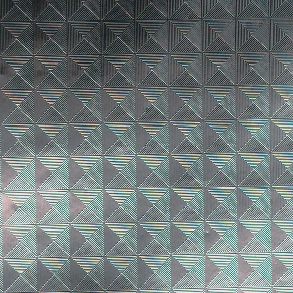 Iridescent and holographic pattern on reflective film, macro photograph of sample B0001441