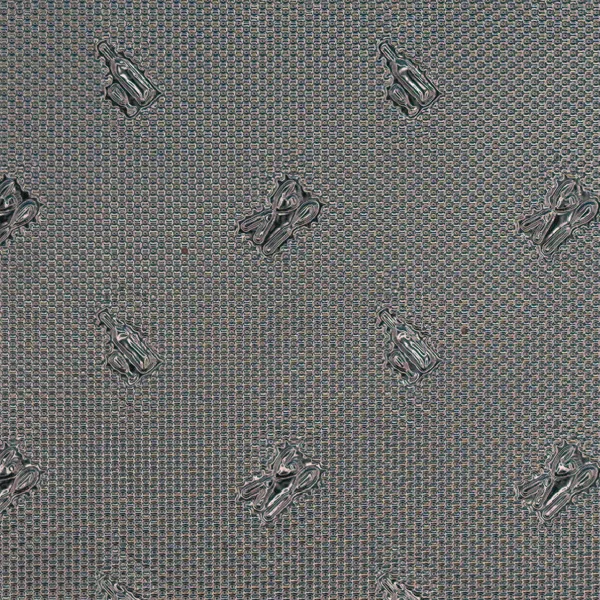 Motif emboss pattern on reflective film, macro photograph of sample B0001449