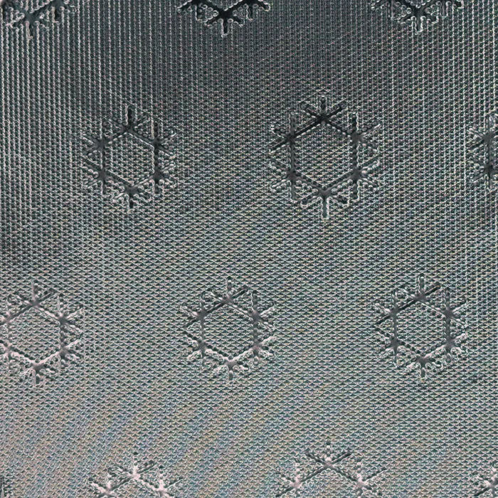 Motif emboss pattern on reflective film, macro photograph of sample B0001457
