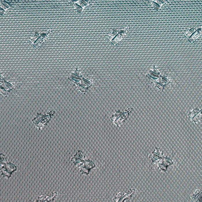 Motif emboss pattern on reflective film, macro photograph of sample B0001489
