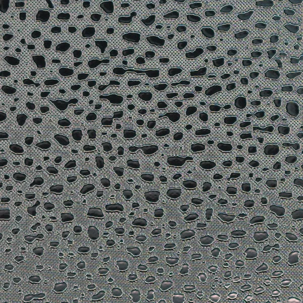 Pebble and droplet pattern on reflective film, macro photograph of sample B0001465